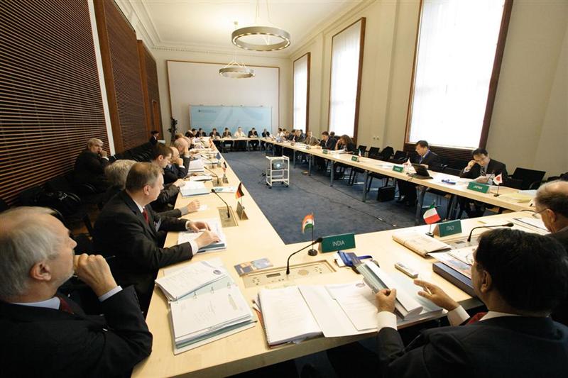 CSLF representatives gathered around four tables arranged in a rectangle